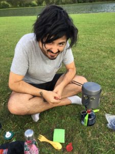 Aydin cooking dinner with the camping knife