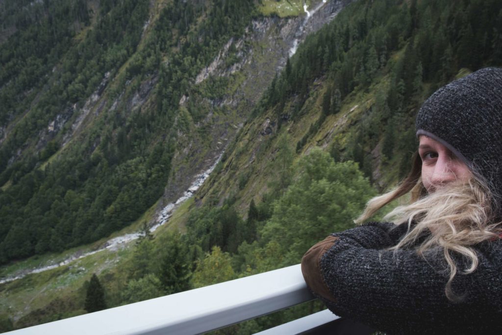 Caroline enjoying the view on the Lächwand elevator with a waterfall in the background