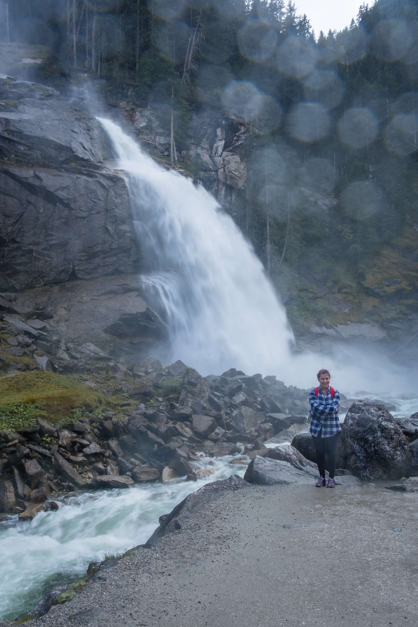 Caroline standing in front of Krimml waterfall getting very wet