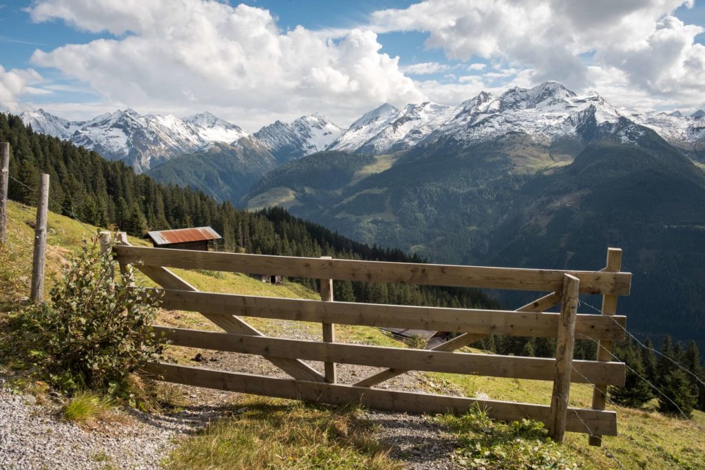 Mountain views with a cute wooden gate with towering mountains behind