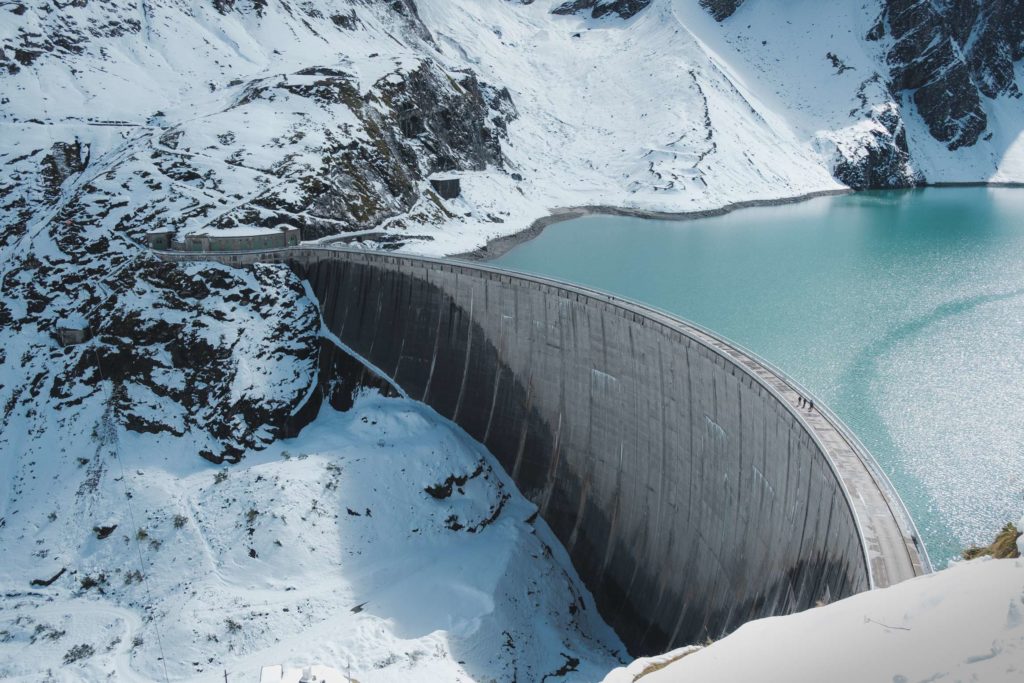 Mooserboden dam wall surrounded by snow