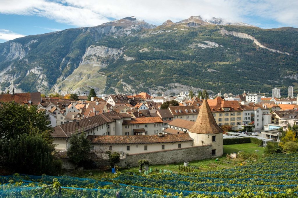 The town walls of Chur from above with mountains in the background