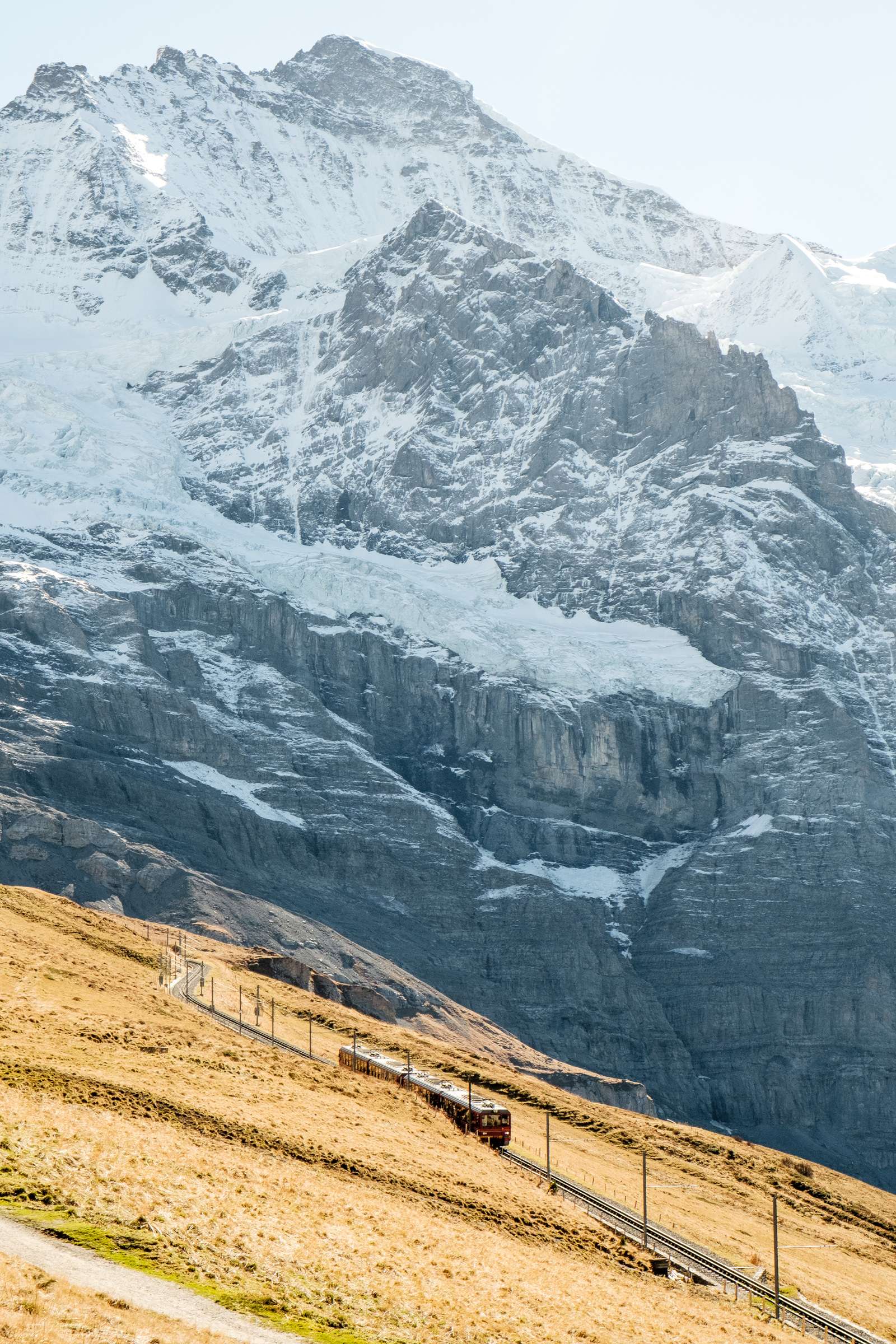 Jungfrau train with huge snowy peak towering over