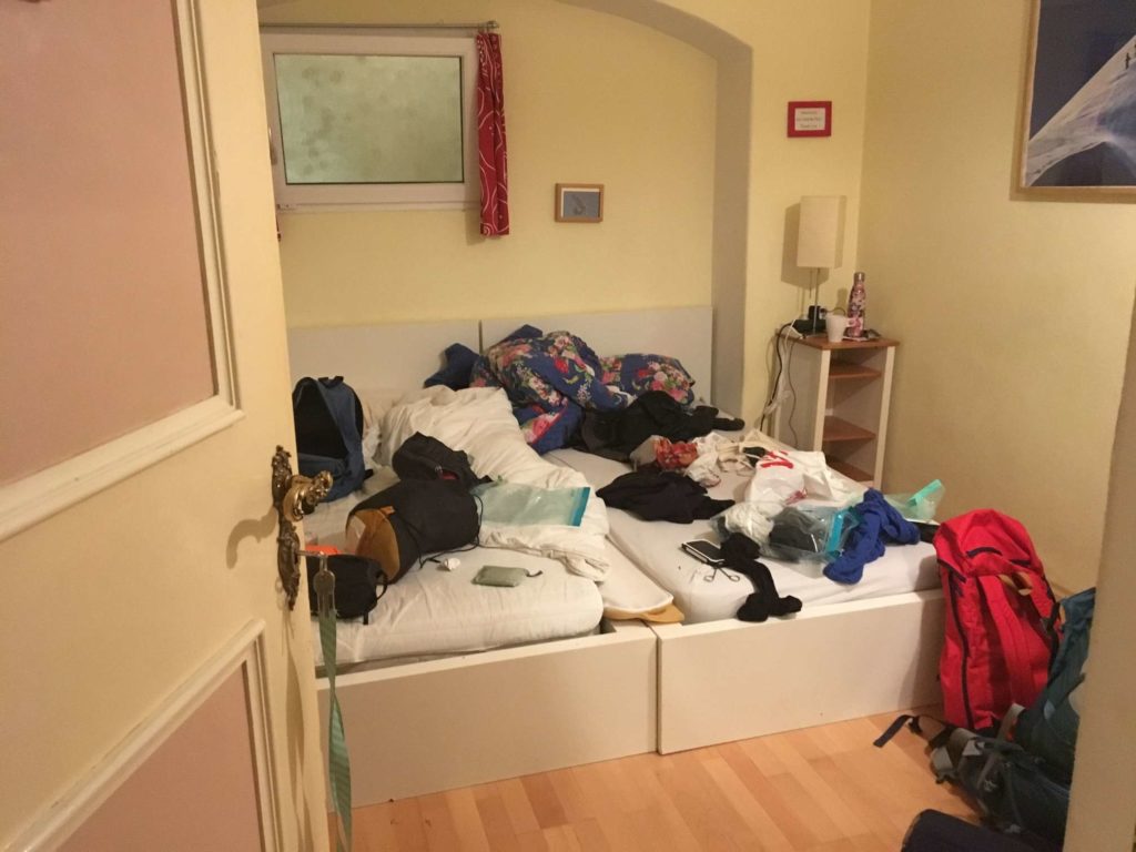 Our small bedroom with no natural light and our rucksacks emptied everywhere
