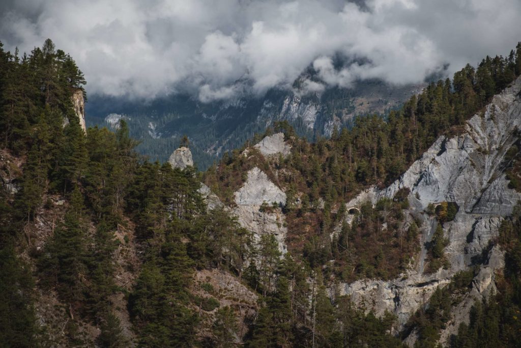 Rocky mountains with tunnels carved through them