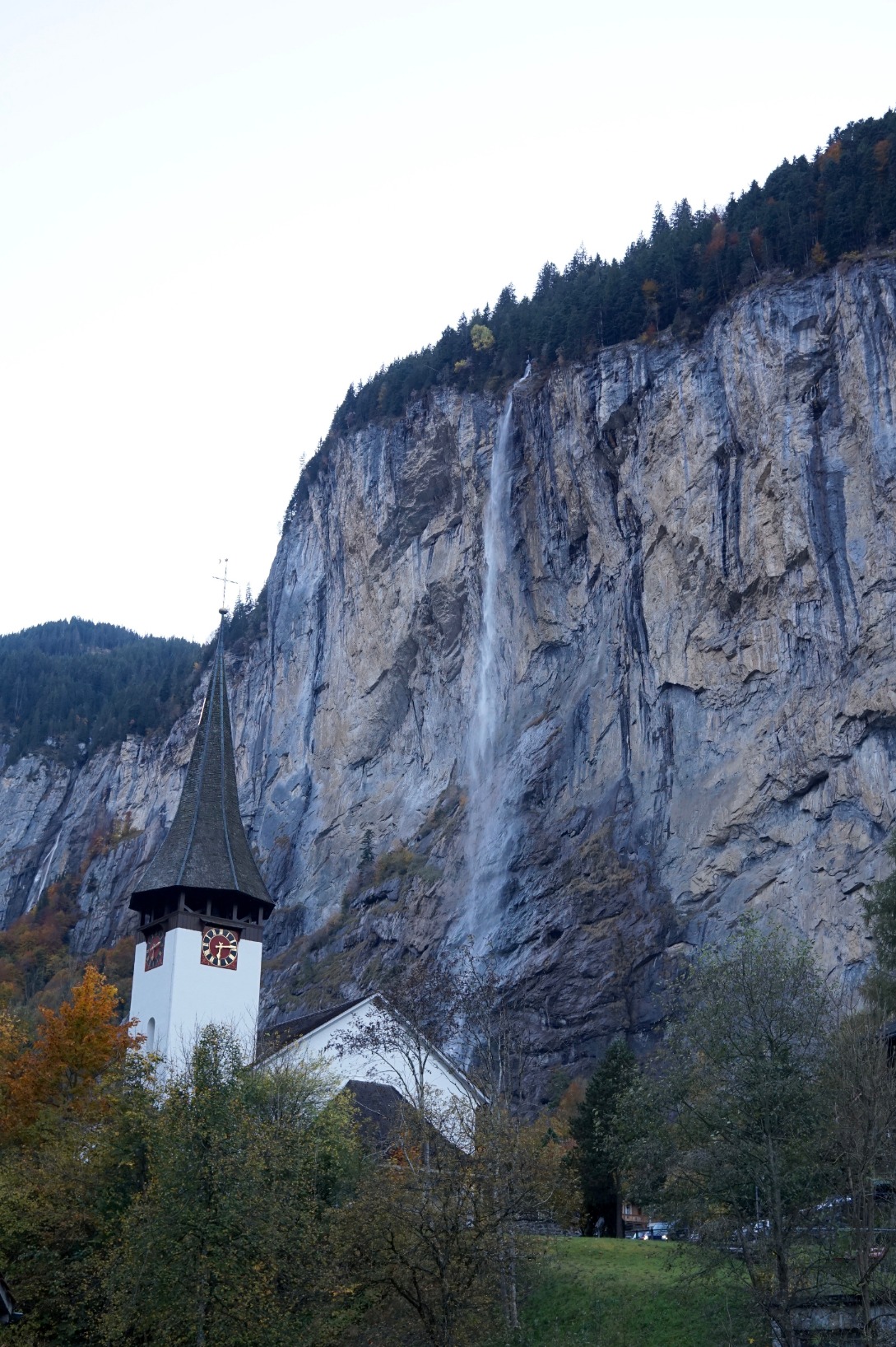 Staubbach waterfall with church in foreground