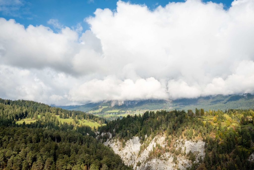 Views from Zault observation deck, masses of cloud covering bright green forests