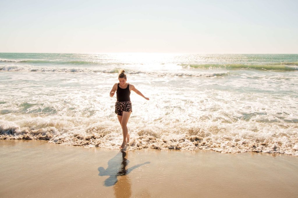 Caroline running on the beach