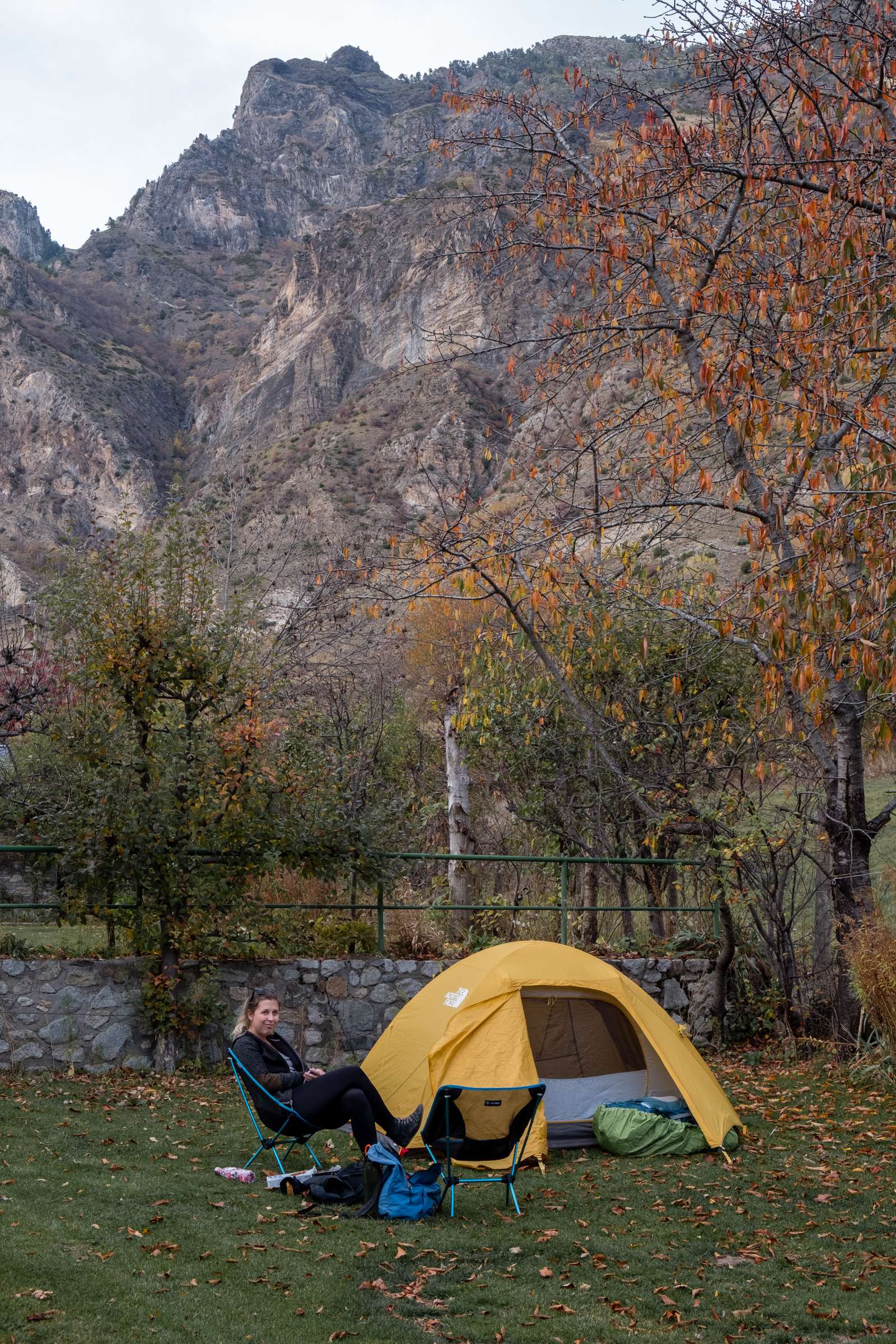 Caroline sitting on our Espot campsite pitch in the Pyrenees