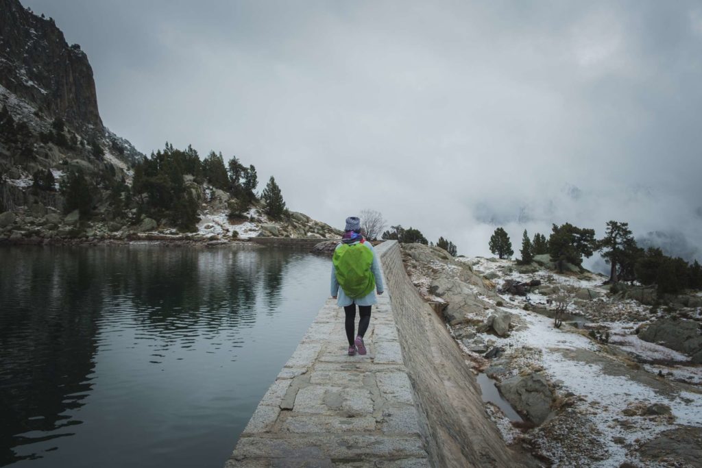 Caroline walking along lake Estany Gran d'Amitges