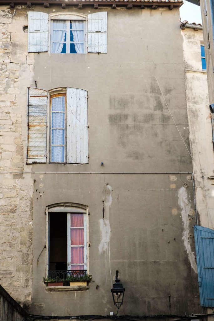 Three odd windows in a line on an old house