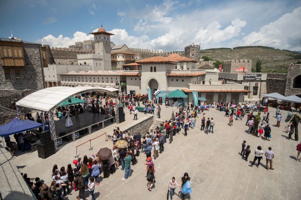 A view on independence day celebrations at Rabati Castle, Samtskhe-Javakheti, from a wall above with the castle in the back