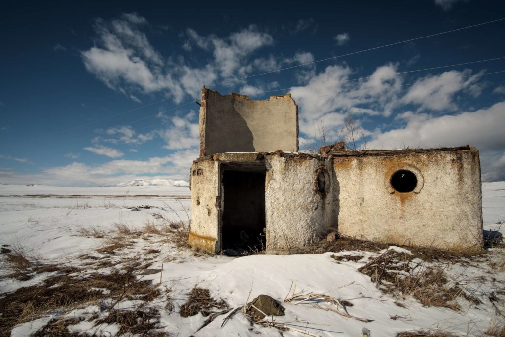 An old crumbling soviet bus stop