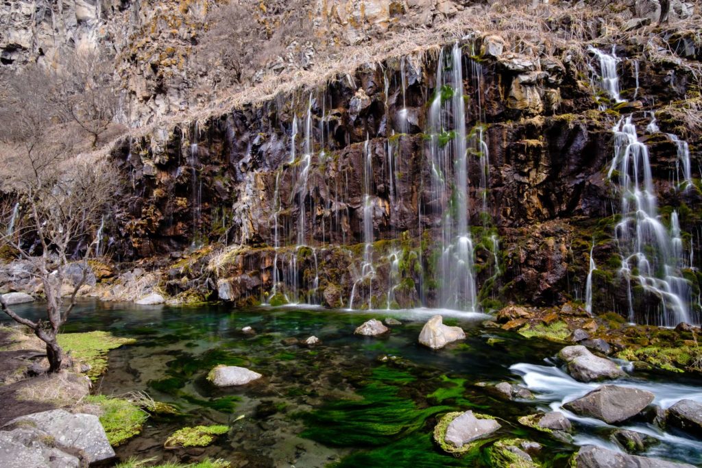 Another angle of Dashbashi waterfalls with green mossy water