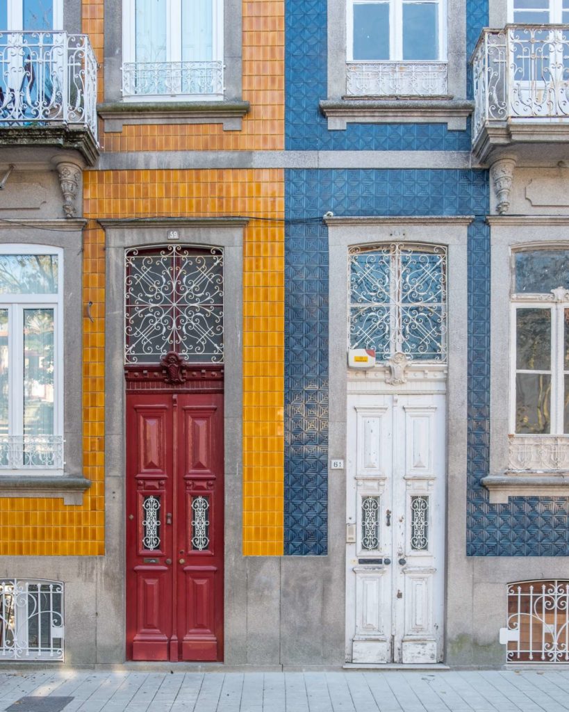 Pretty houses with symmetrical contrasting tiles in Porto