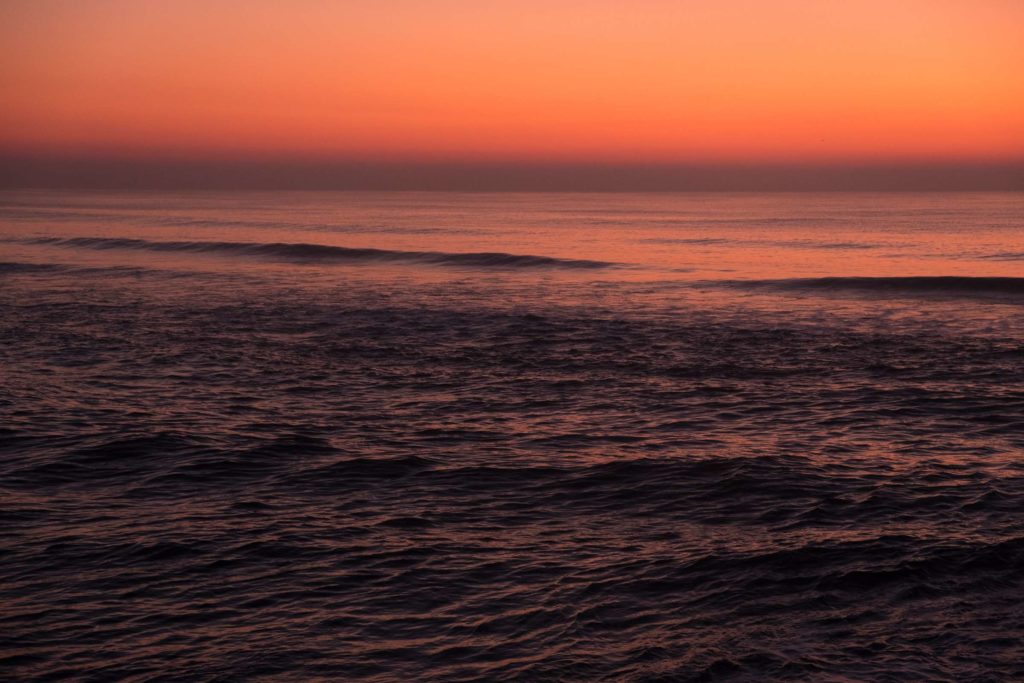 Sunset reflecting in the sea at Costa Nova beach