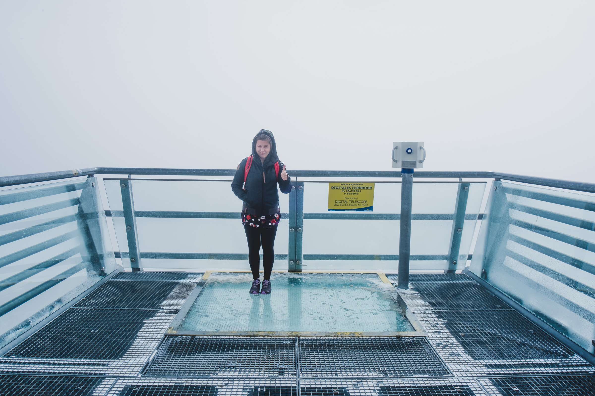 Caroline standing on the glass Dachstein skywalk