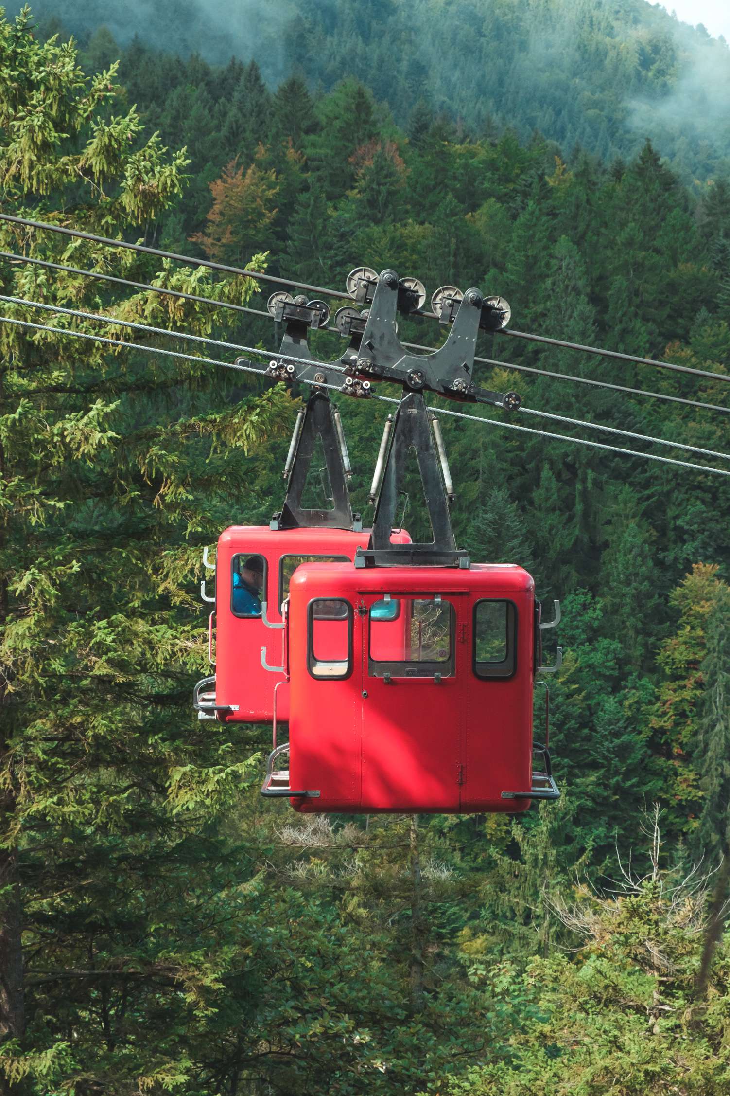 Red cable cars near St. Gilgen