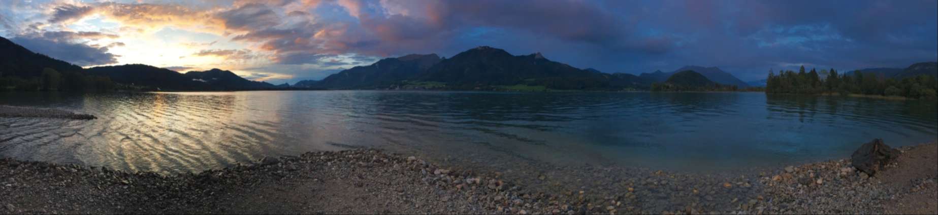 Wolfgangsee sunset panorama from a secret beach
