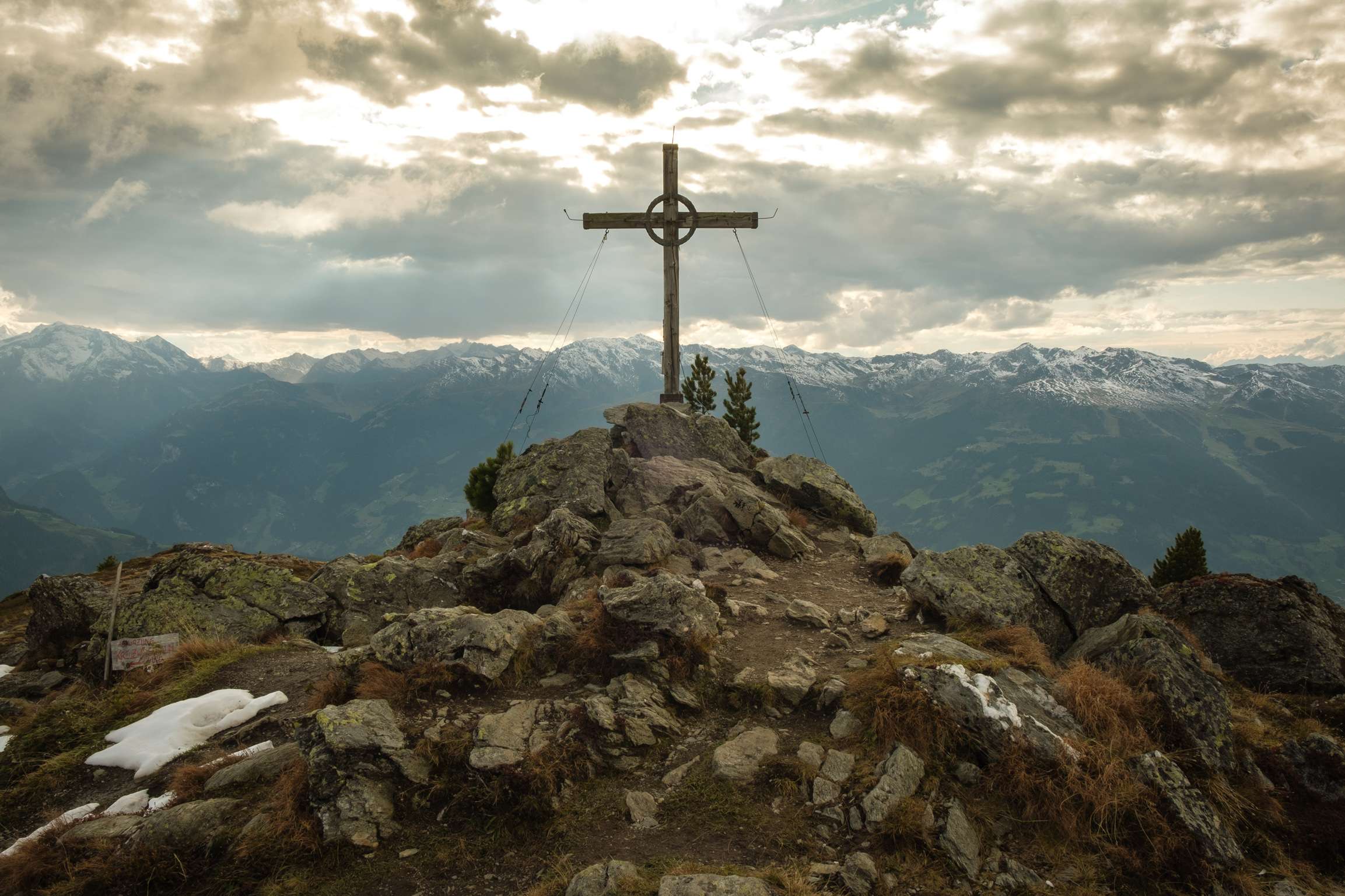 A Cross at the peak of Karspitze with moody cloudy afternoon light