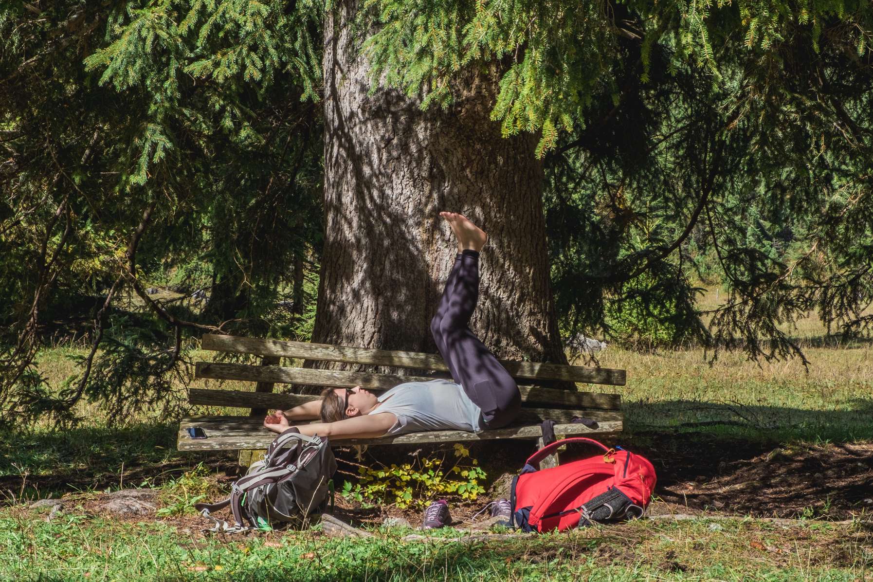 Caroline stretching on a bench whilst taking a break.