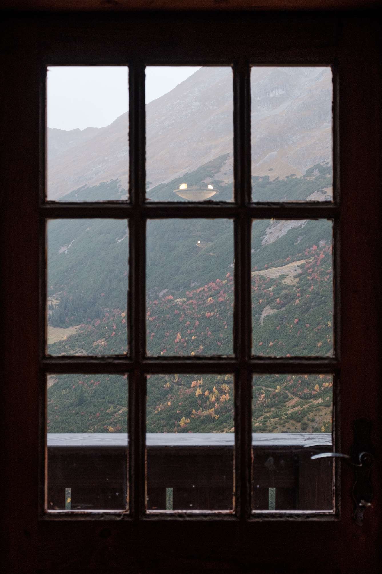 View from the mountain lodge window in the morning, landscape looking very gloomy