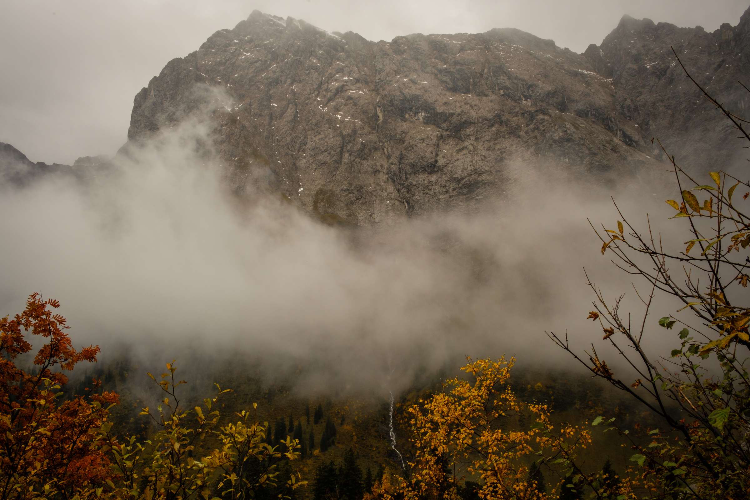 Waterfalls forming from massive clouds in the valley, Karwendel