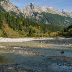 The river shallows and widens engulfing the valley in the Karwendel mountains