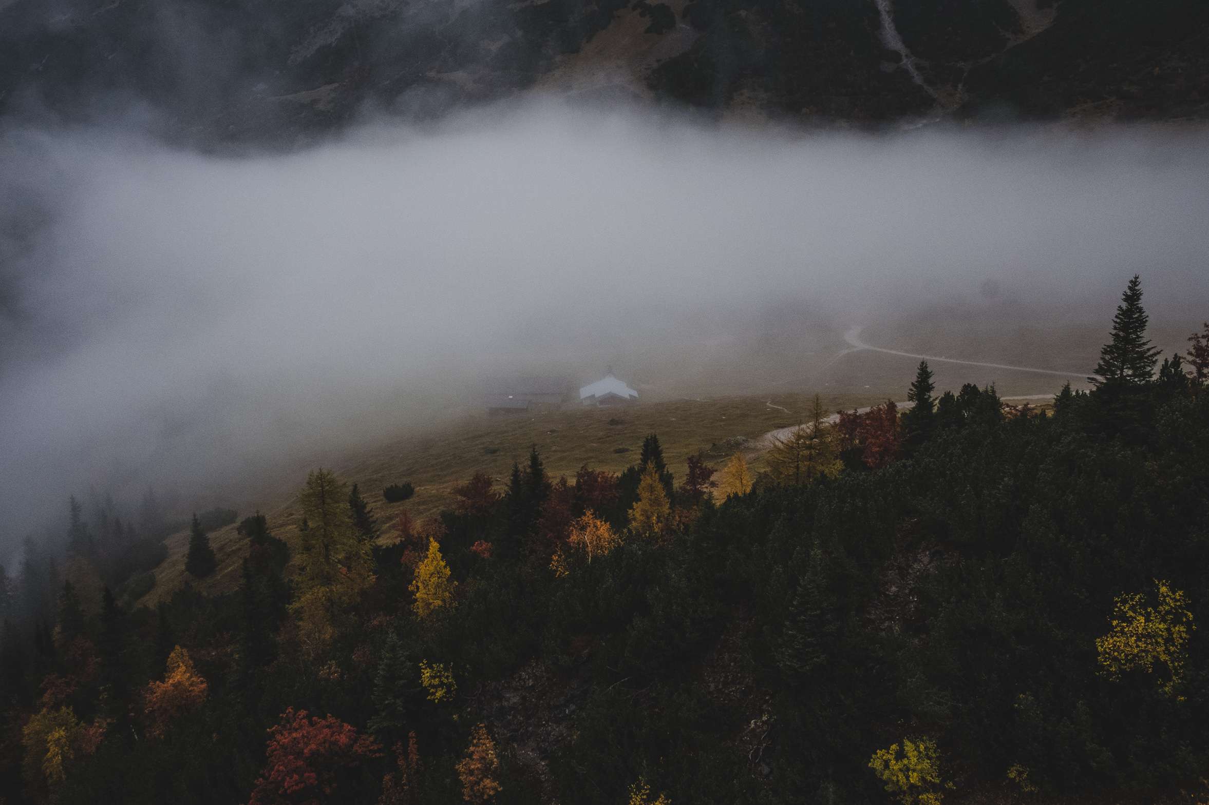 The view outside the lodge, low hanging clouds. Dark and moody.