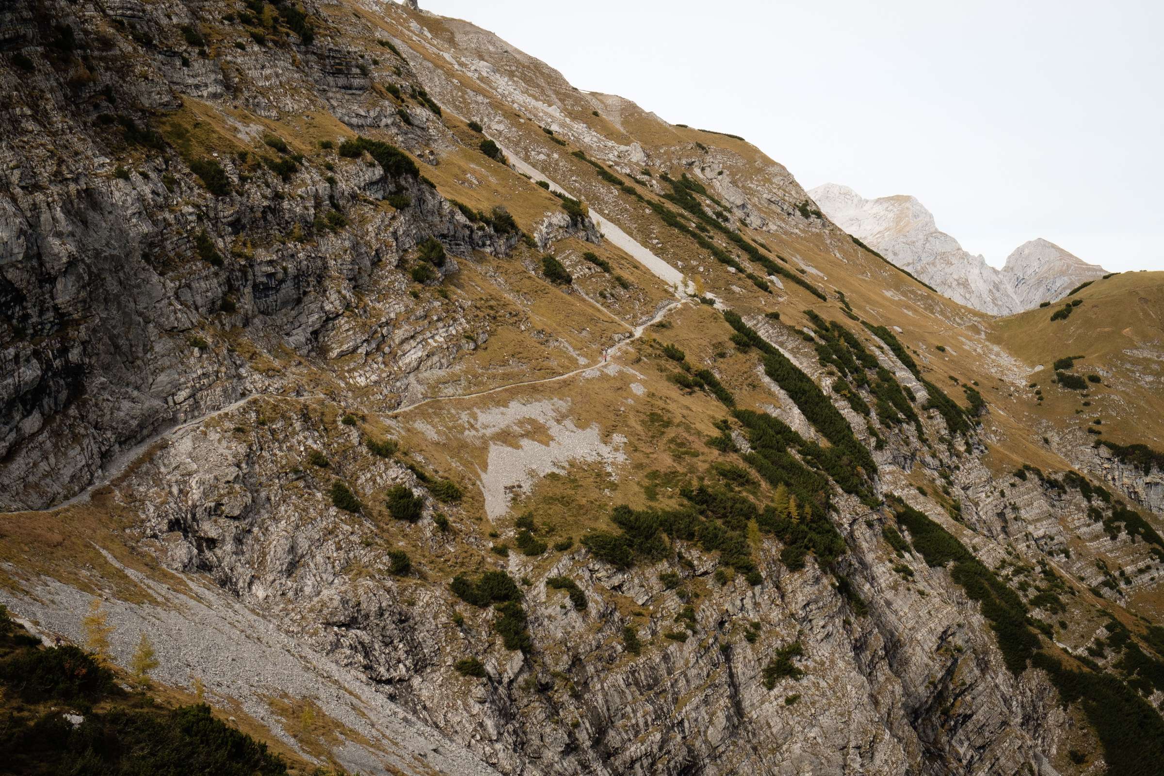 The trail where it crosses Lamsenjoch Saddle, steep cliffs and a small terrifying path