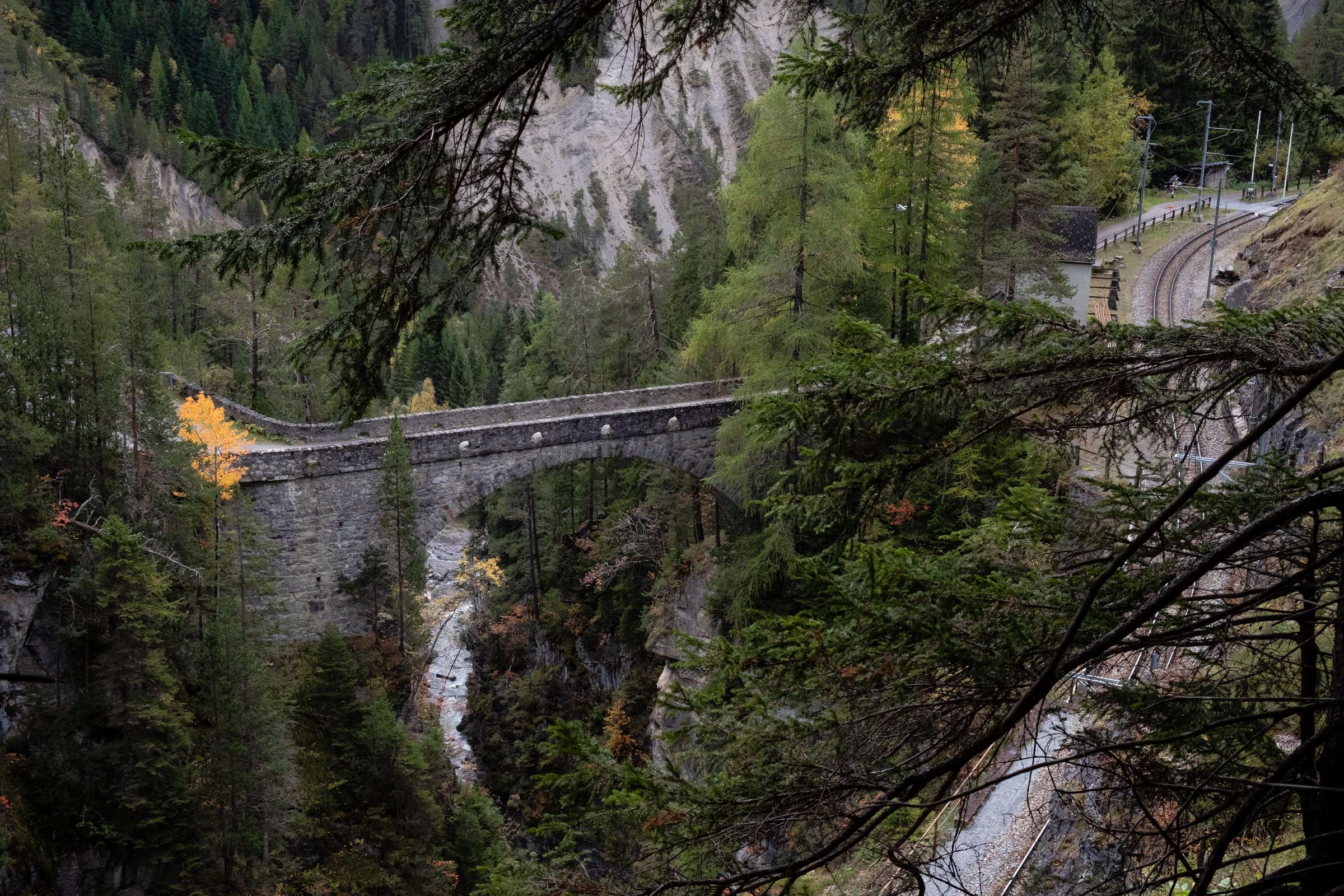 An old bridge and train station in the canyon on the Glacier Express