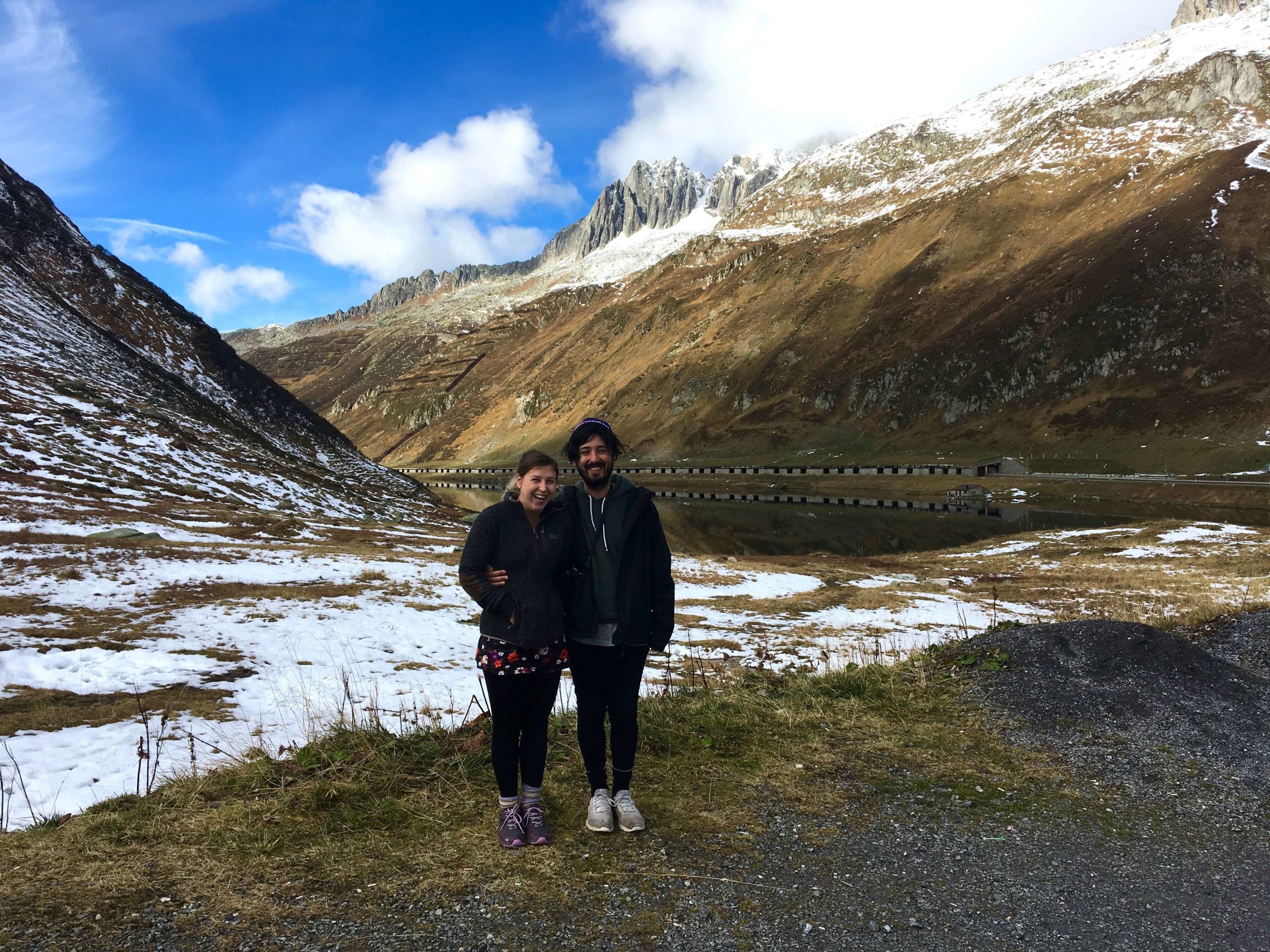 Caroline and Aydin laughing on top of Oberalp Pass