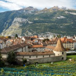 The town walls of Chur from above with mountains in the background