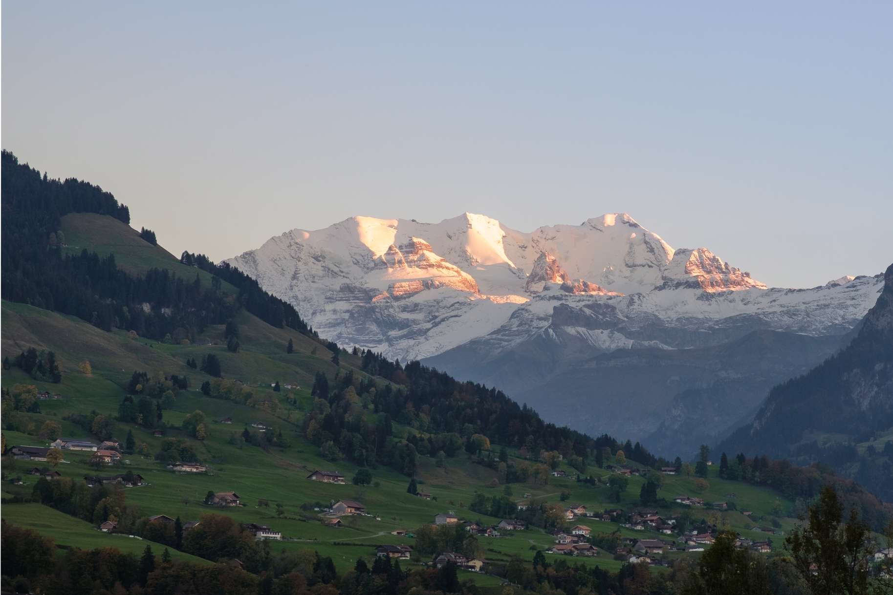 The Sunsetting over Jungfrau with a cute alpine village in the foreground