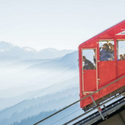 Super closeup of the Niesenbahn with people looking out the windows