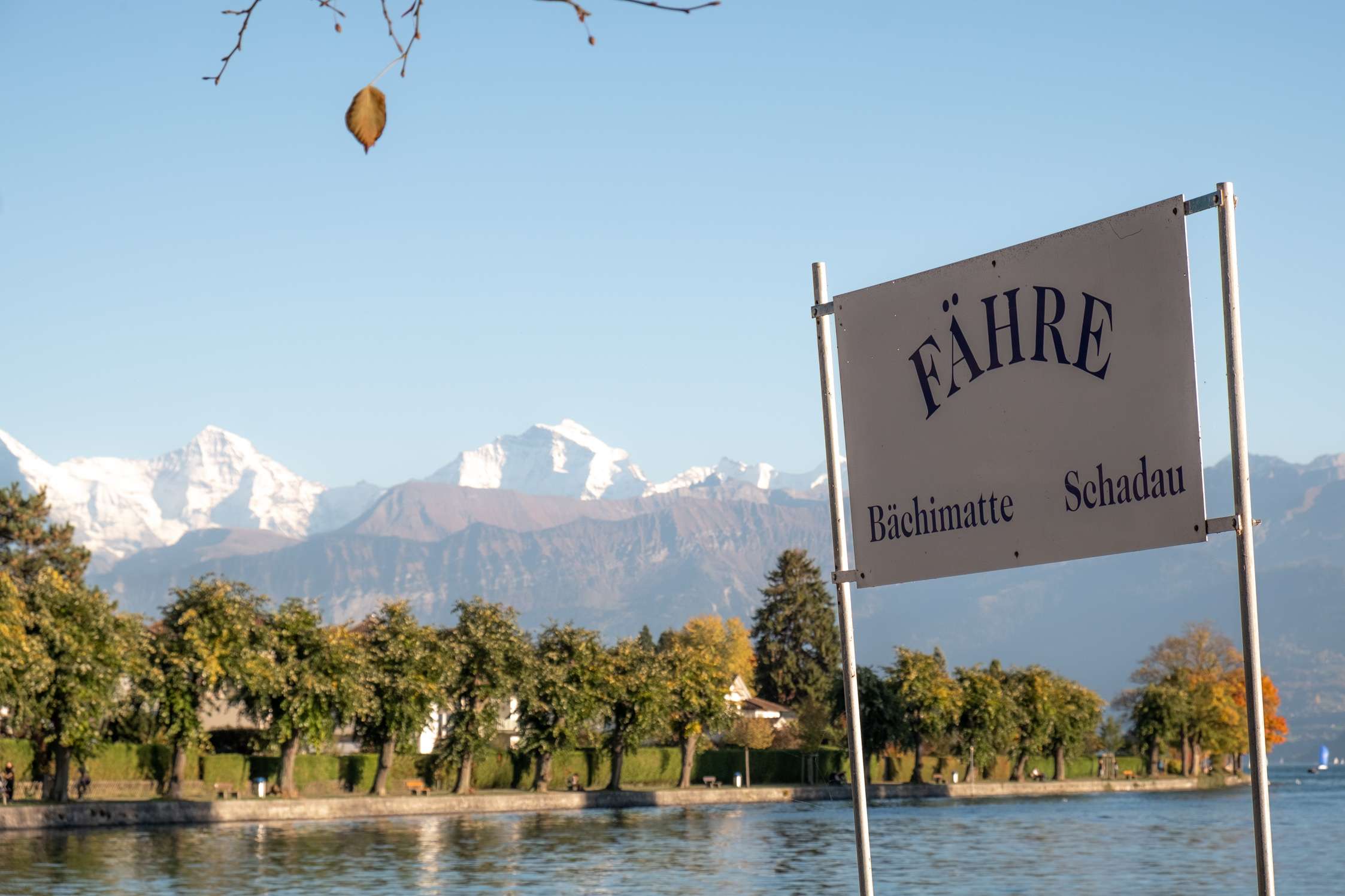 Thun ferry port with lake and mountains in background