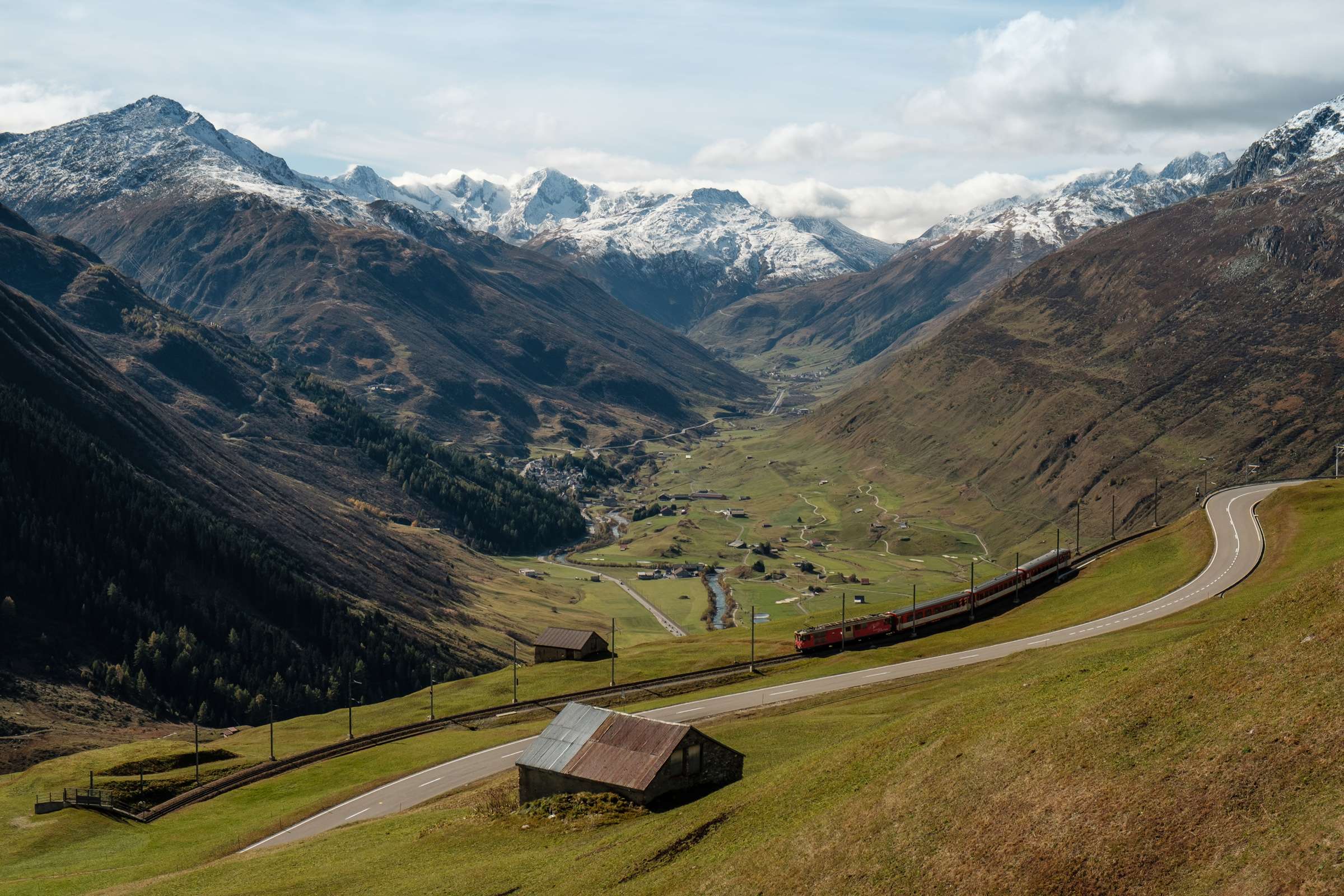 Pciture perfects cene of Switzerland. A Train on the Glacier Express route above Urseren valley