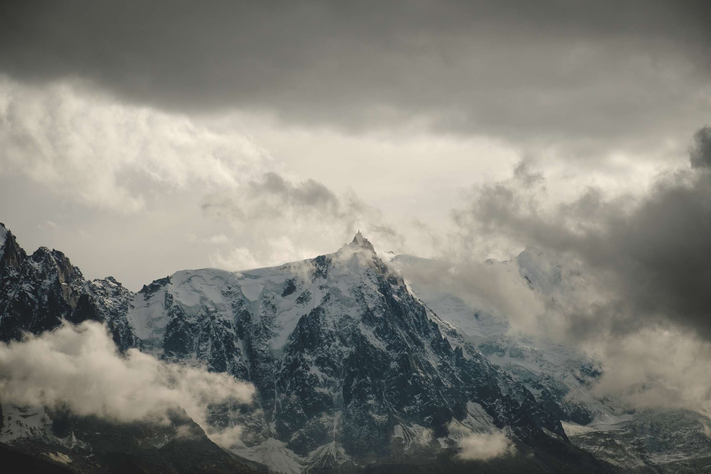 Clouds in front of radio tower on Mont Blanc