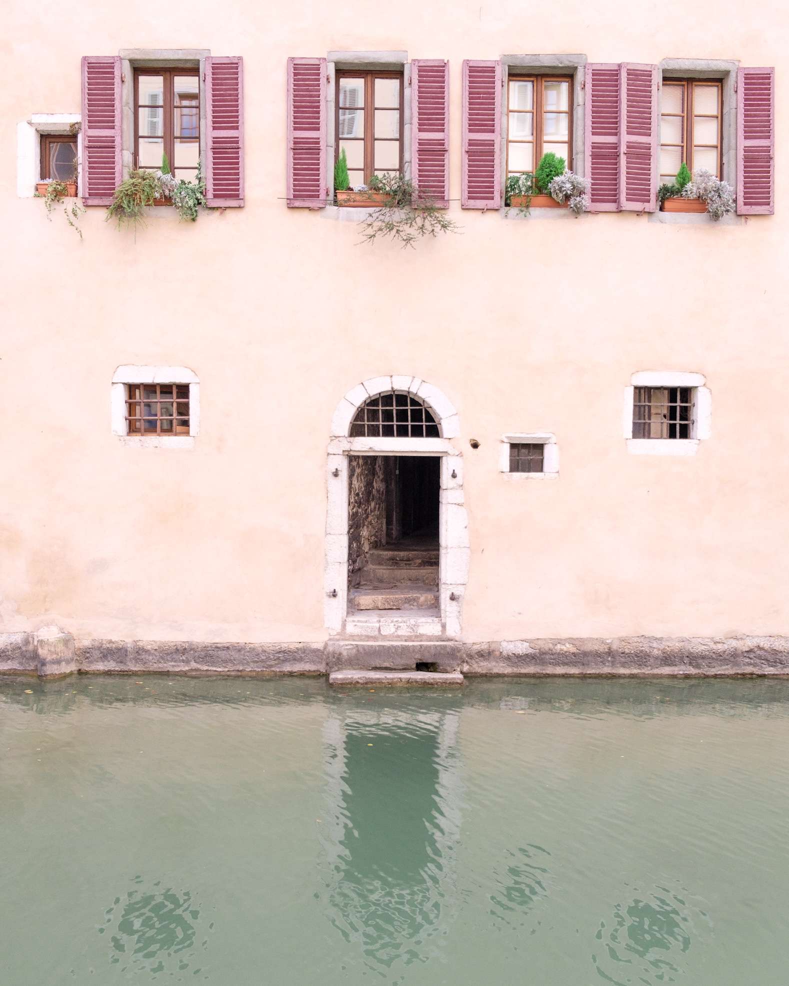 Cute house with a door leading to the canal