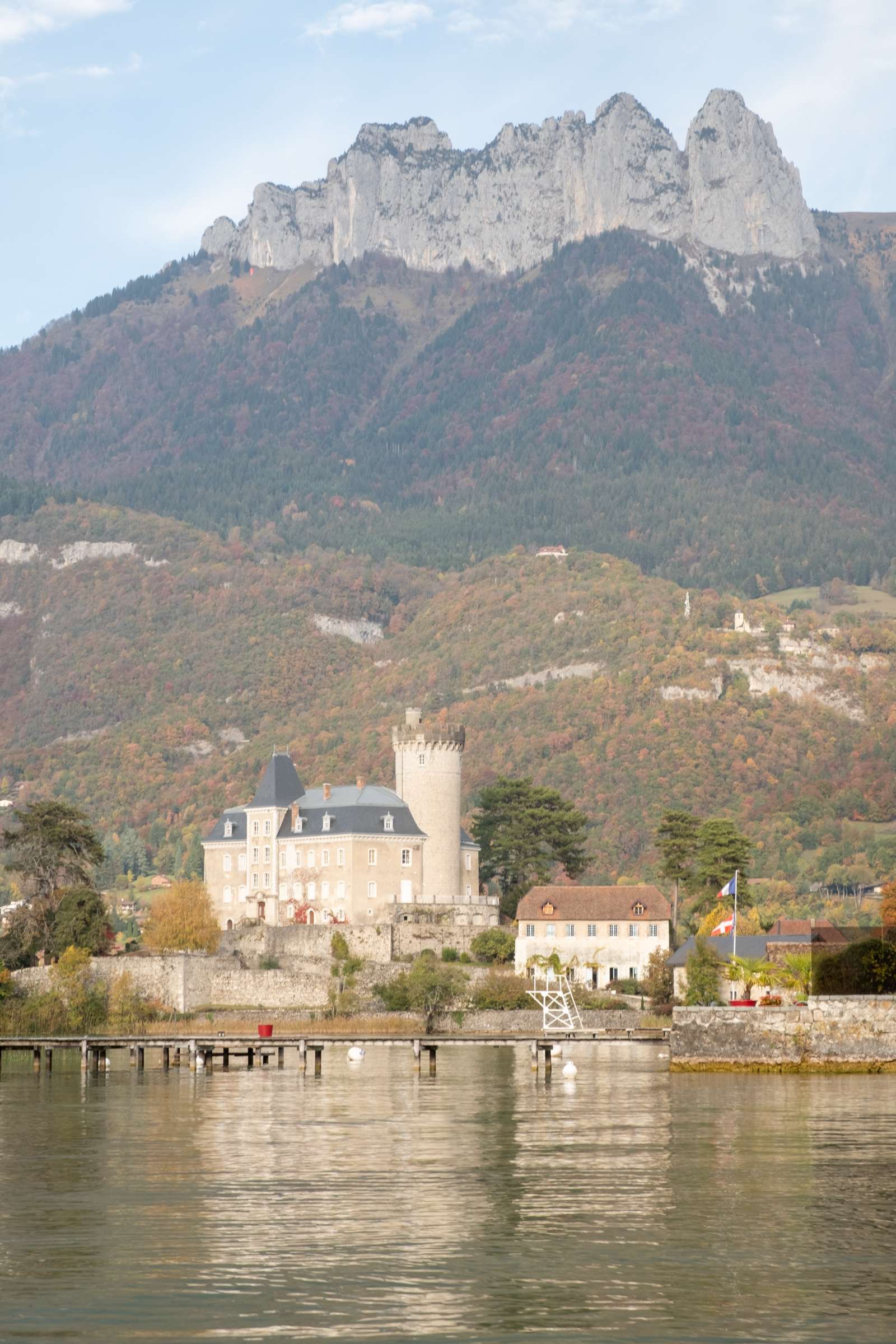 Duingt castle with mountains in background