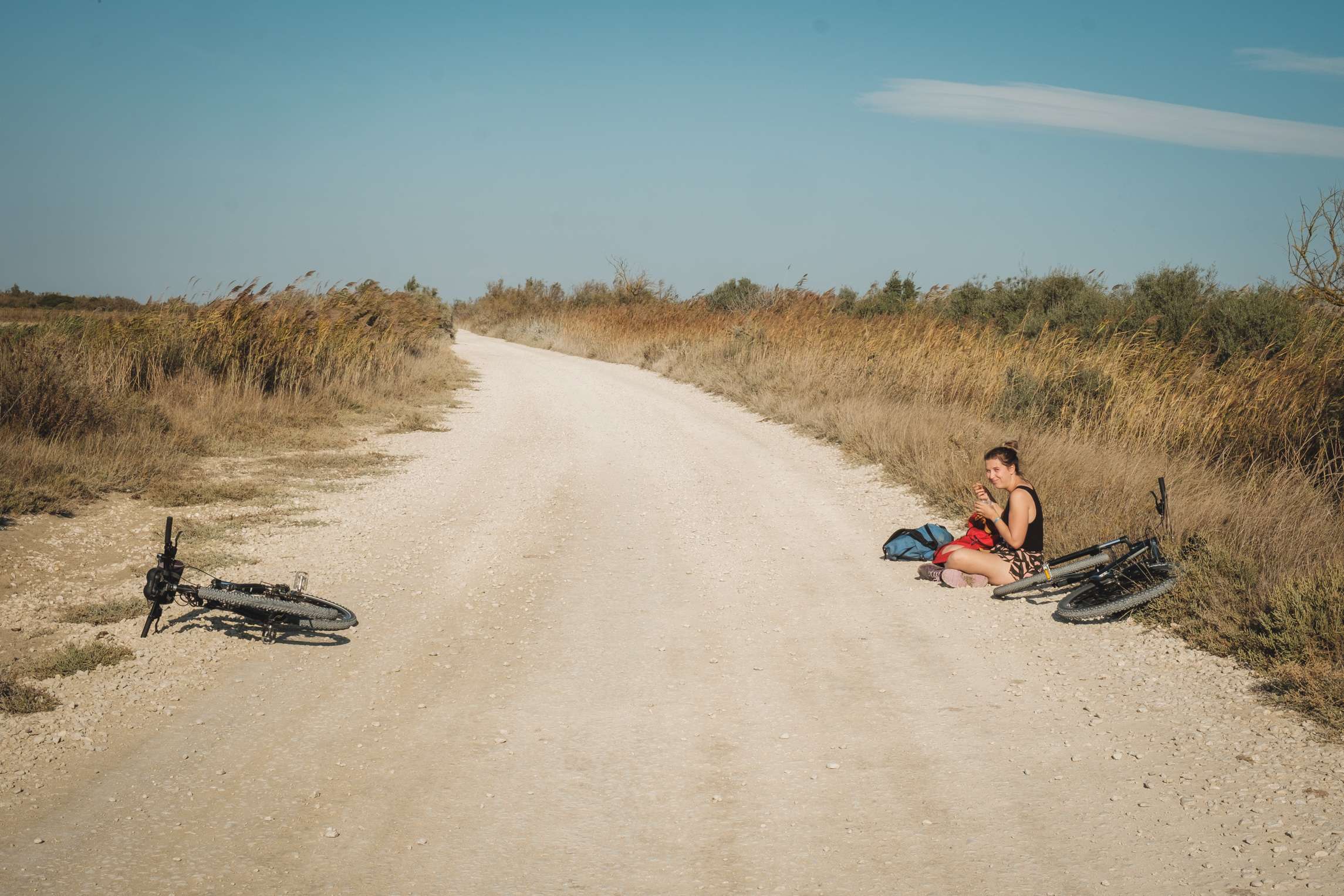 Caroline eating lunch during a bike ride break