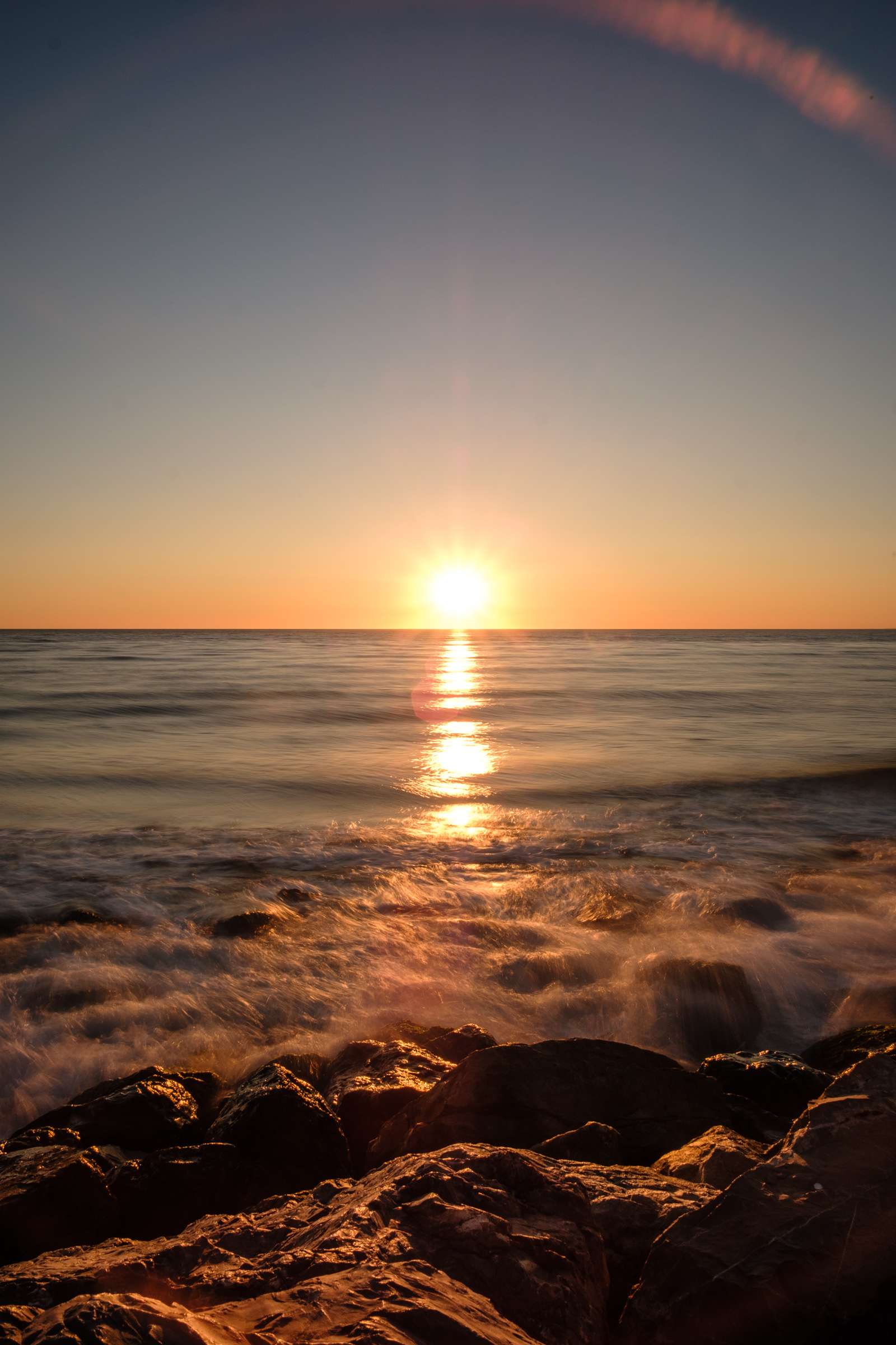 Camargue sea sunset over rocks