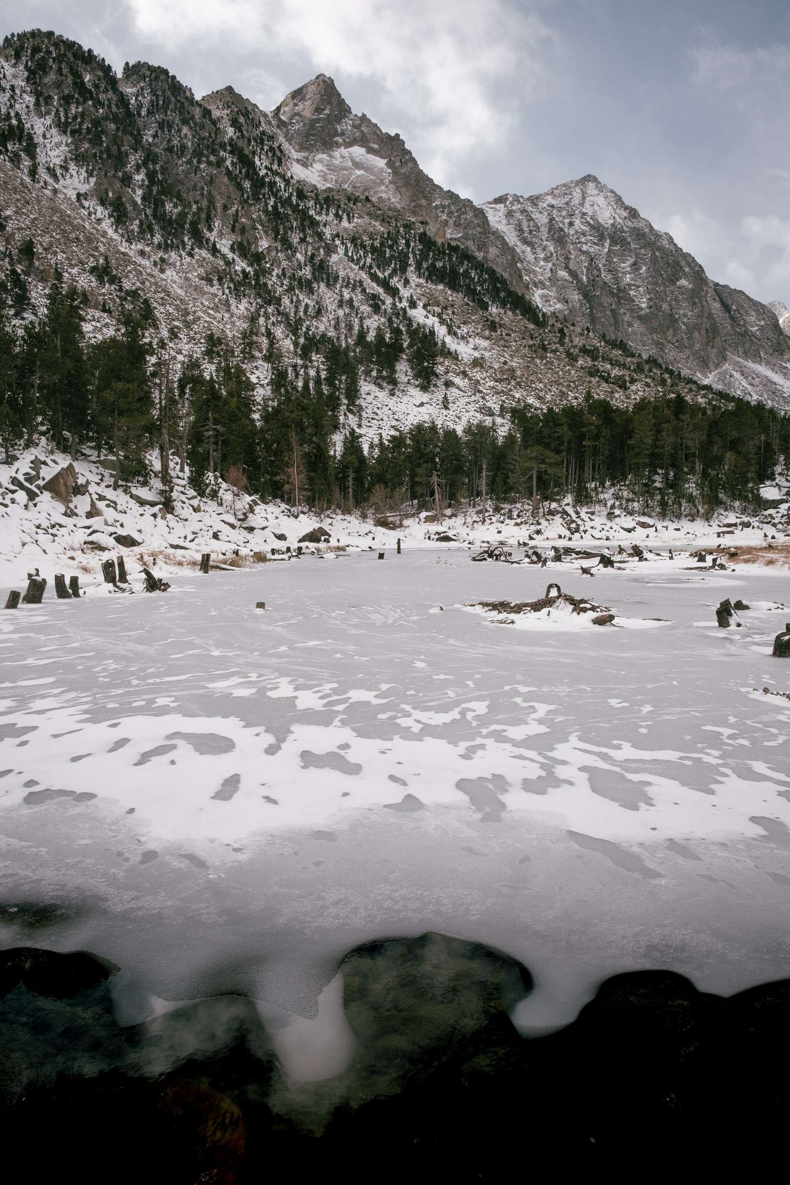 Lake Lladres with a sheet of ice covering it