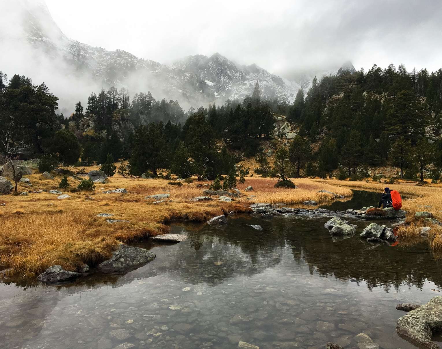 Aydin taking photos of mountain reflections