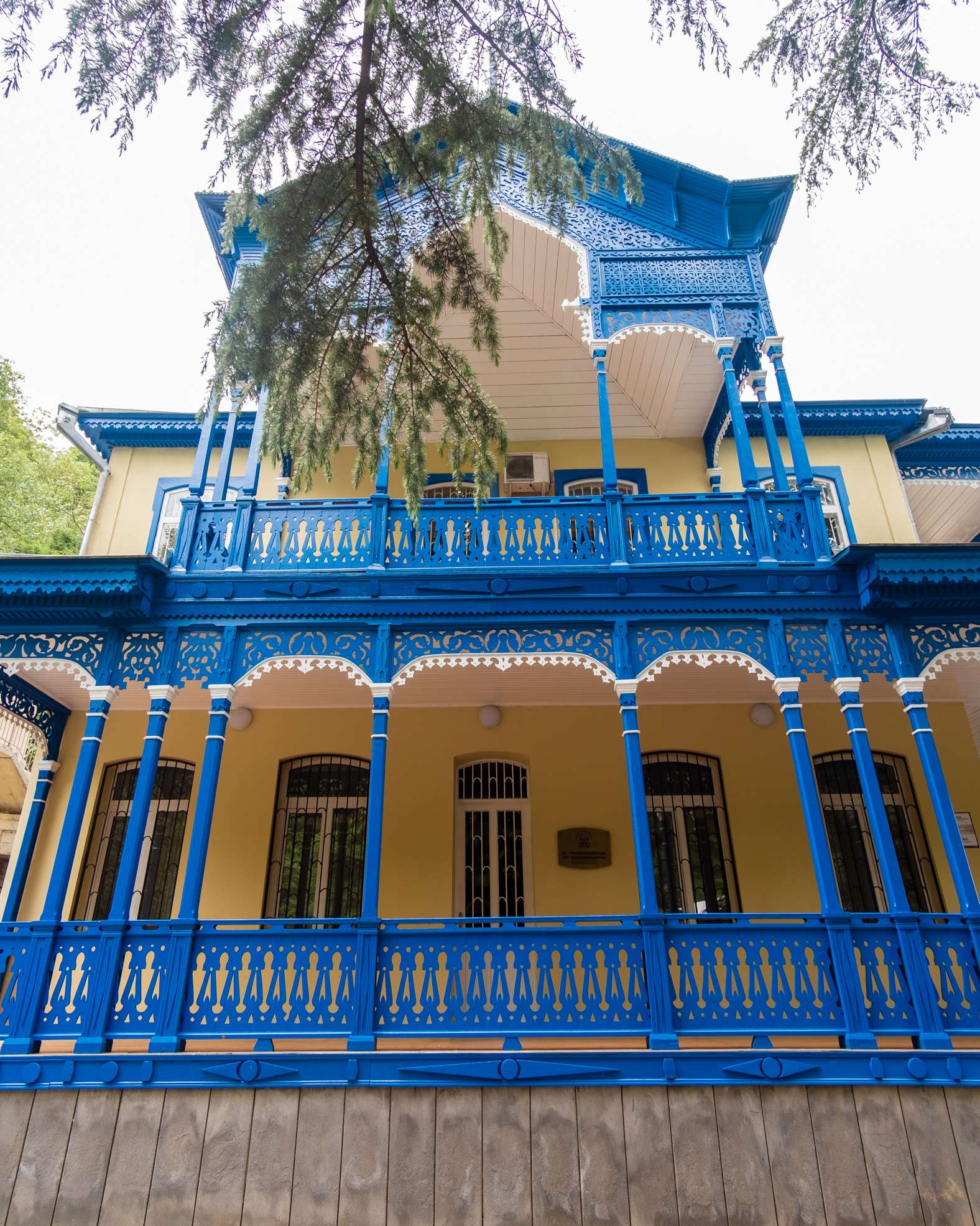 A beautifully restored yellow and blue building in Borjomi