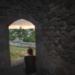 View from Rabati Castle through a window on Akhaltsikhe, Samtskhe-Javakheti, with Caroline in front