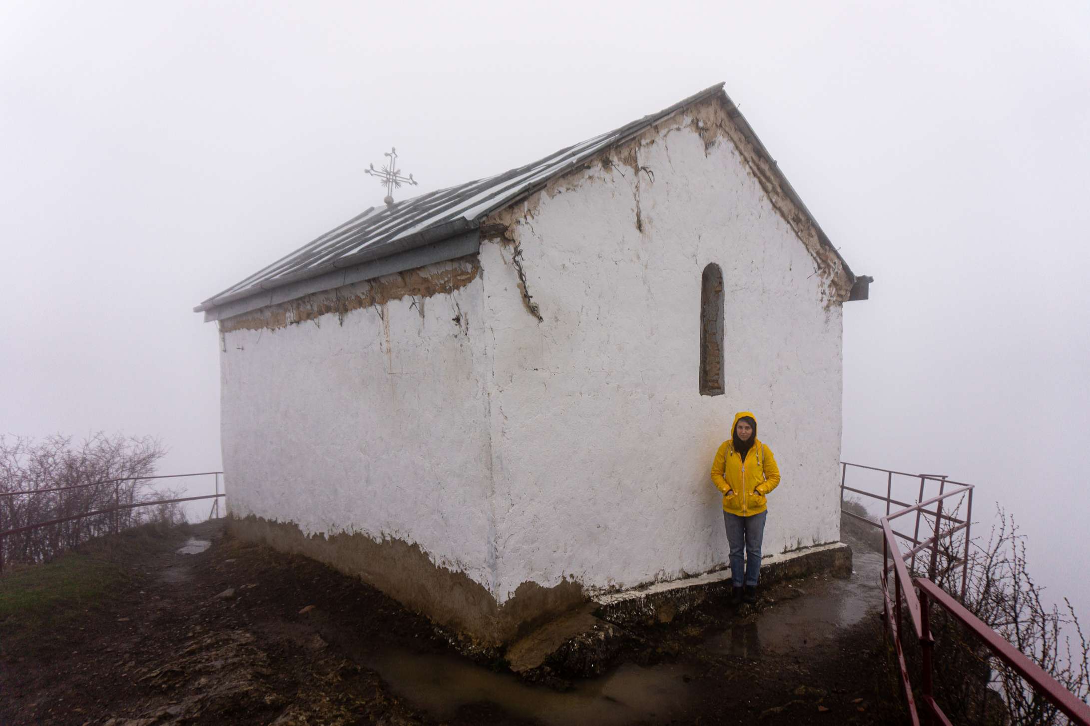 Caroline standing next to Tsveri church in the thick fog