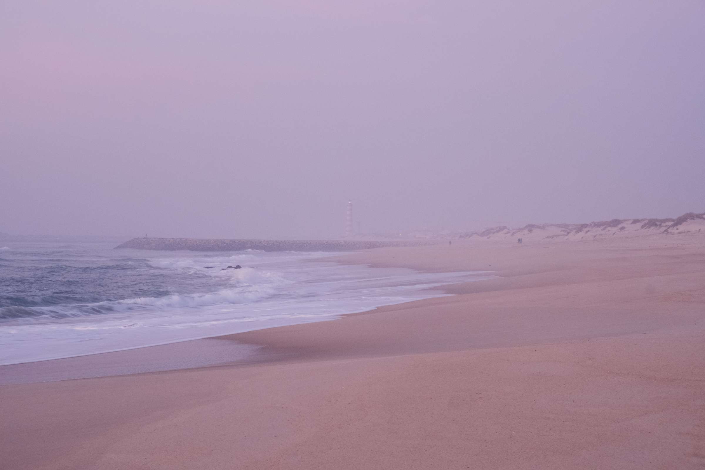 Costa Nova beach with pink mist after sunset