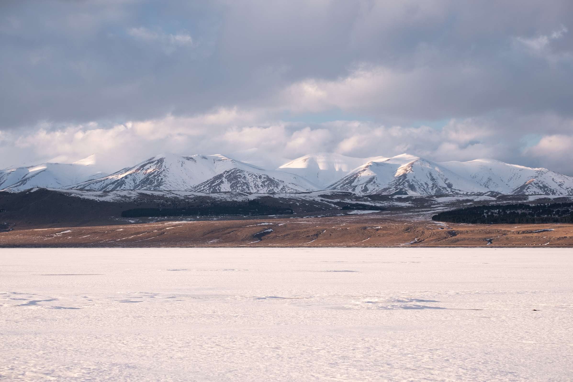 Tsalka reservoir with snowy mountains in the background