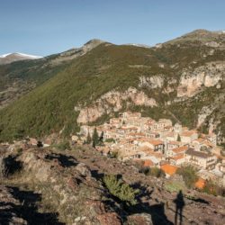 View over Castellar de n'Hug and the surrounding mountains, snowy peaks in the background